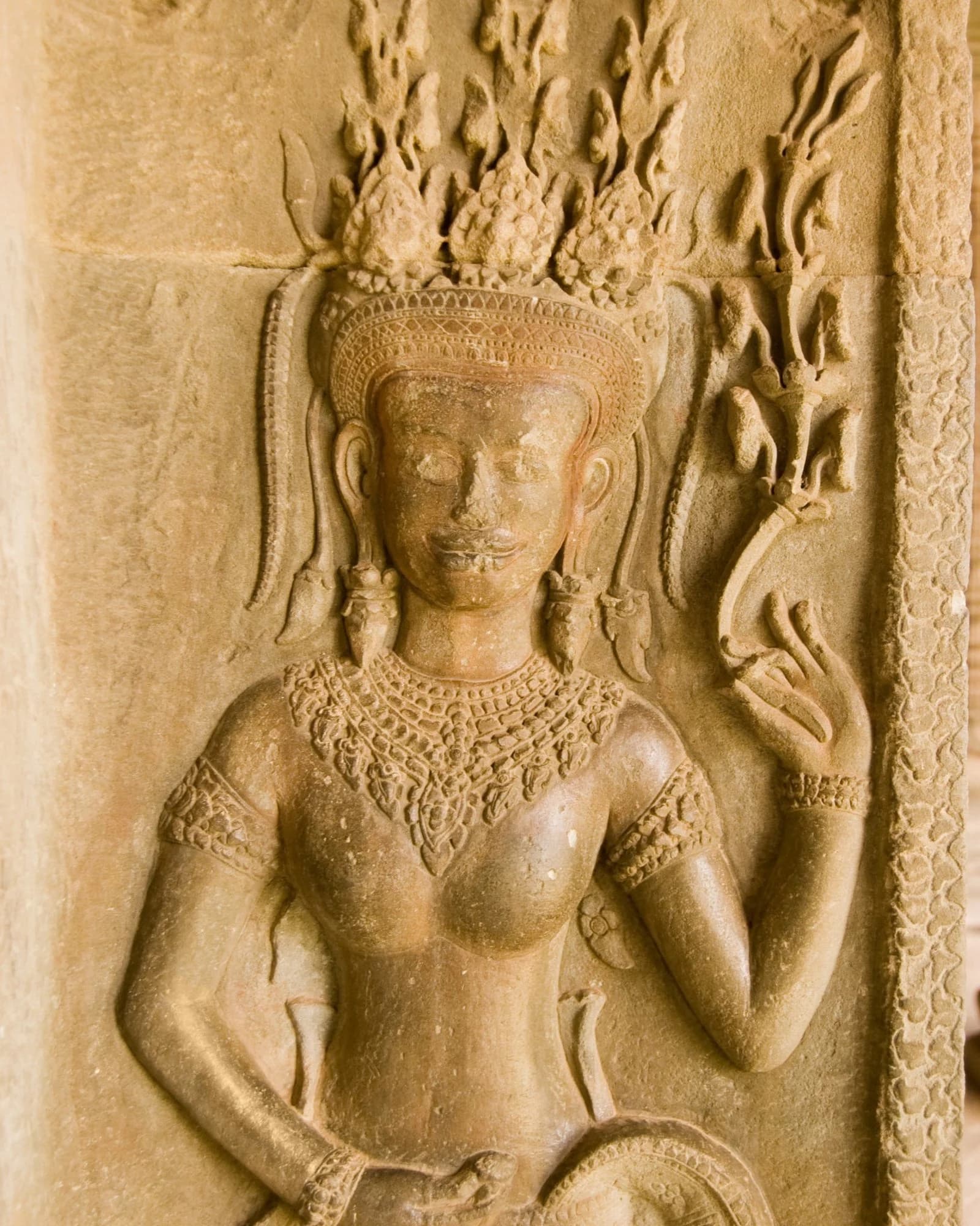 Apsara bas-relief carved into the temple wall